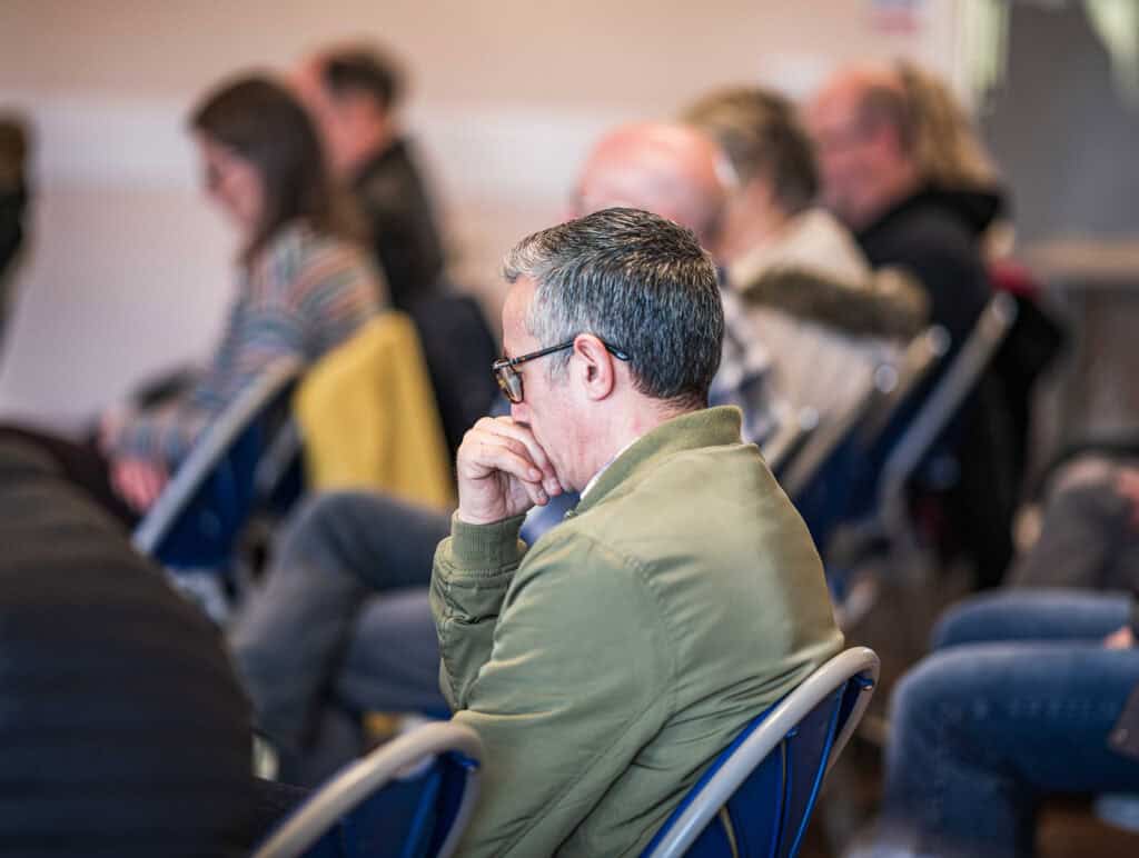 Man thinking in a congregation