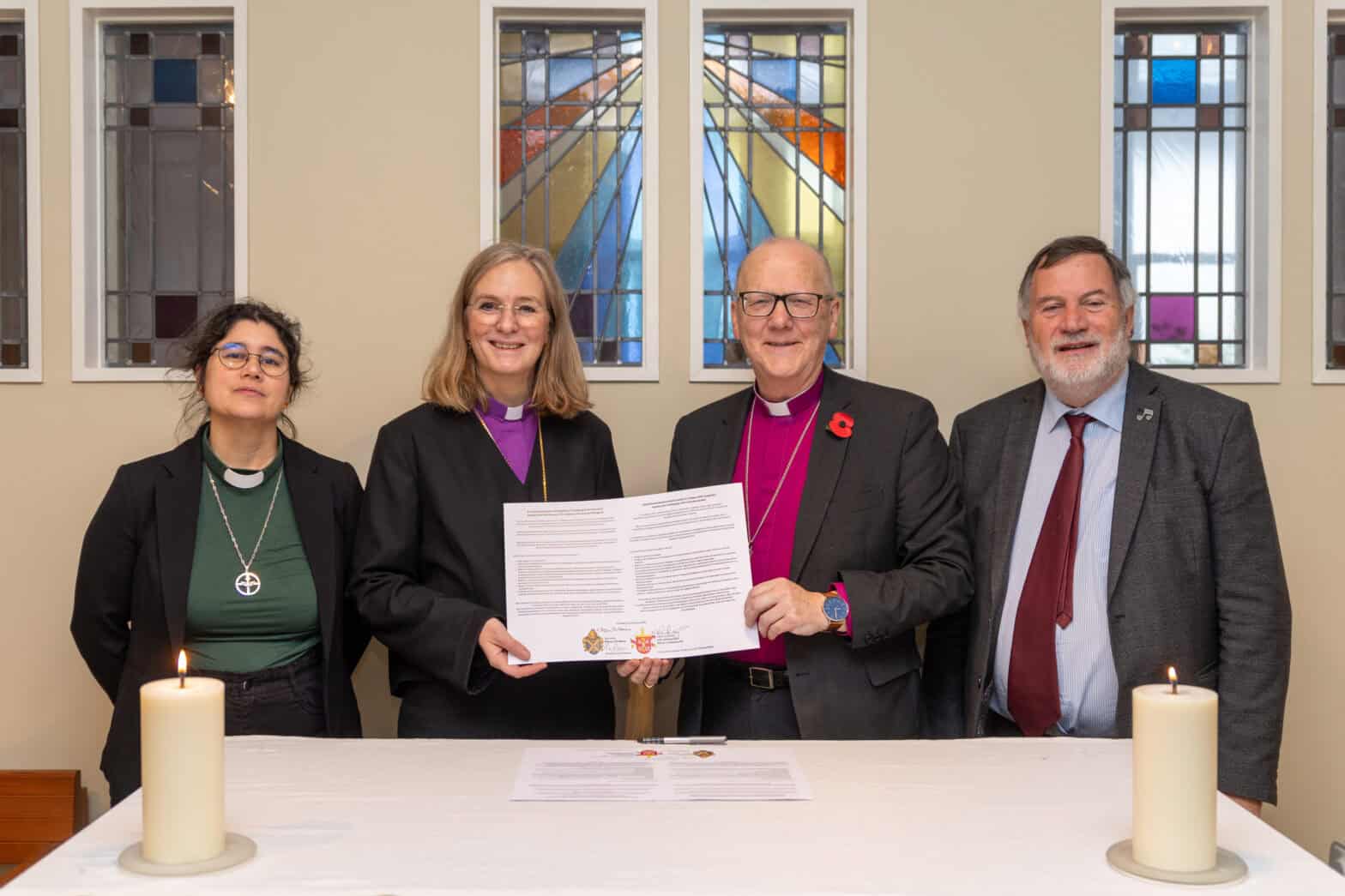 Bishop Alan and Marika sign covenant.